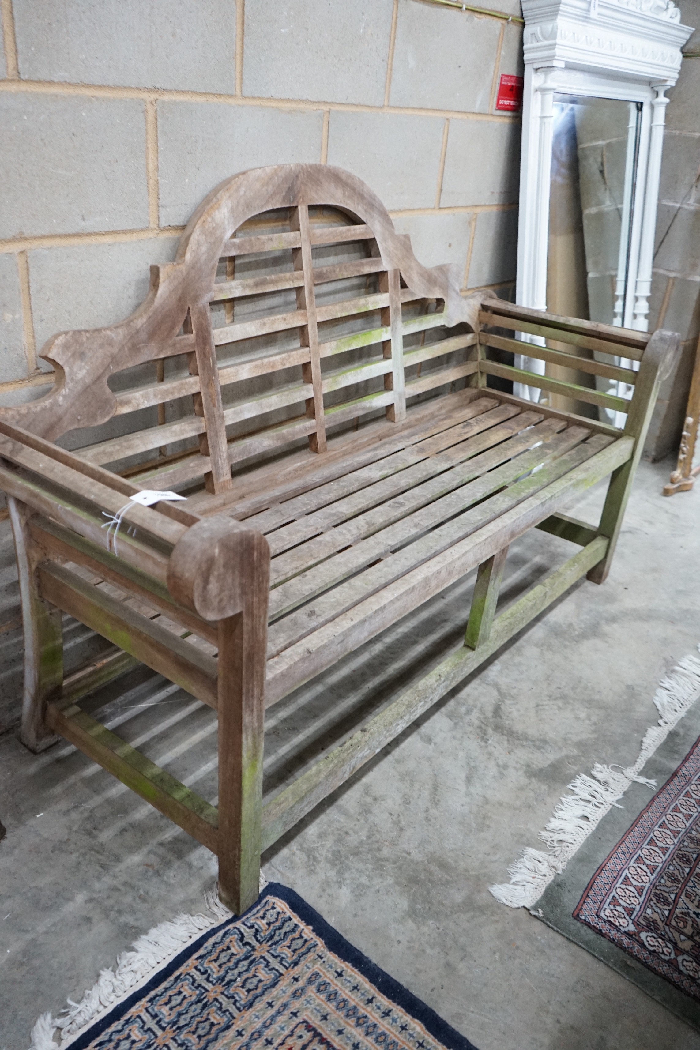 A Lutyens style weathered teak garden bench width 166cm, depth 62cm, height 106cm